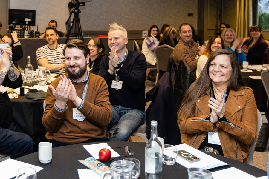GS100223_Inform_2869 People give a round of applause at the Inform Together event