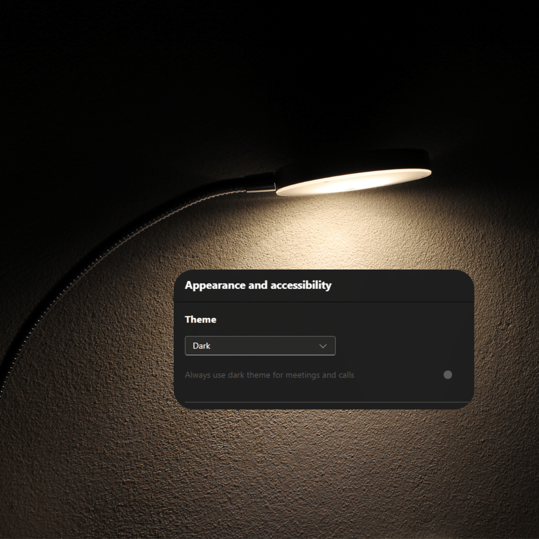 dark-mode a lit lamp in a dark room with a black box containing Microsoft dark theme settings